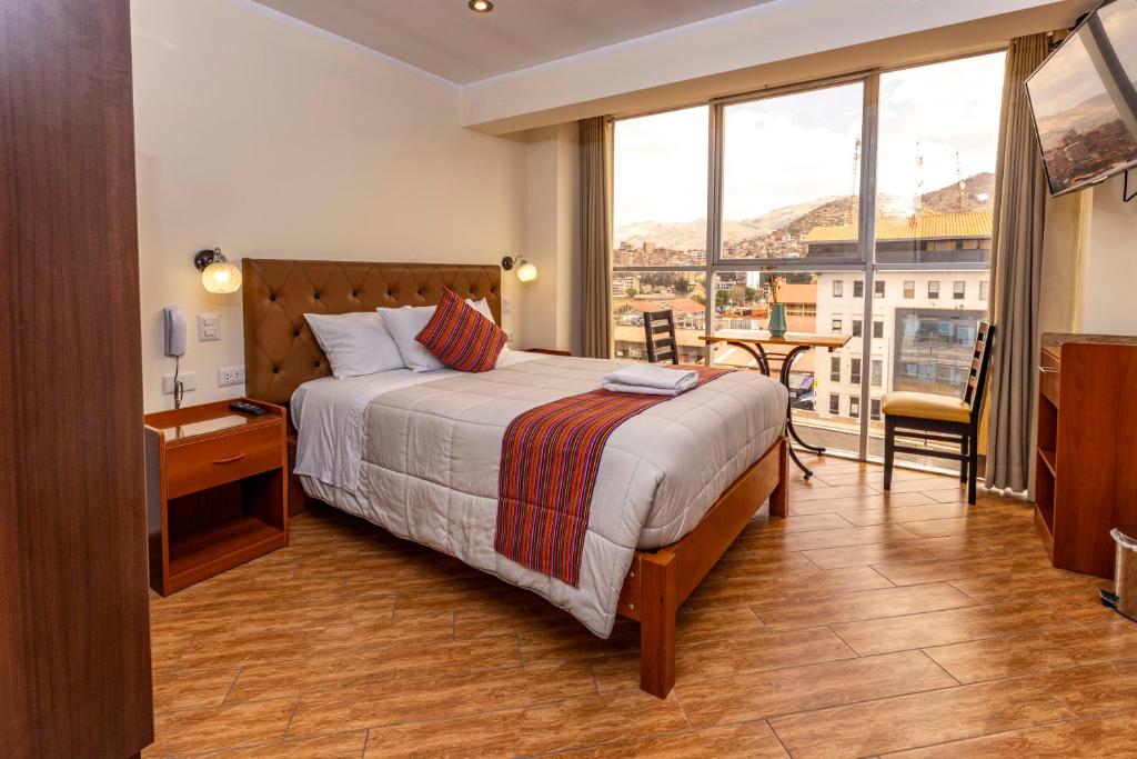 Postel nebo postele na pokoji v ubytování Hotel Sky Mirador