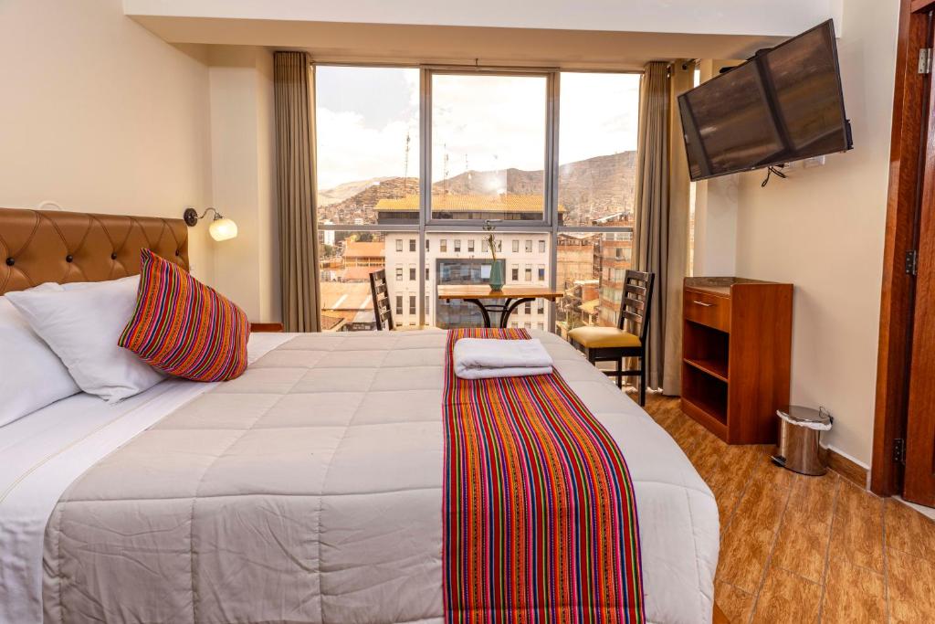 Postel nebo postele na pokoji v ubytování Hotel Sky Mirador
