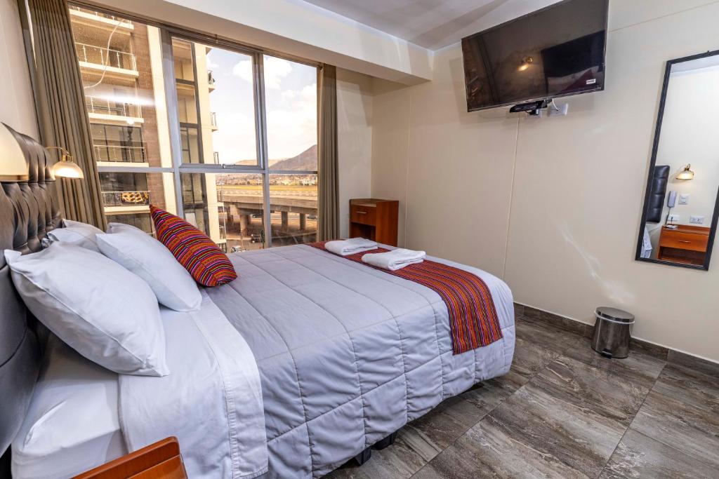 Postel nebo postele na pokoji v ubytování Hotel Sky Mirador