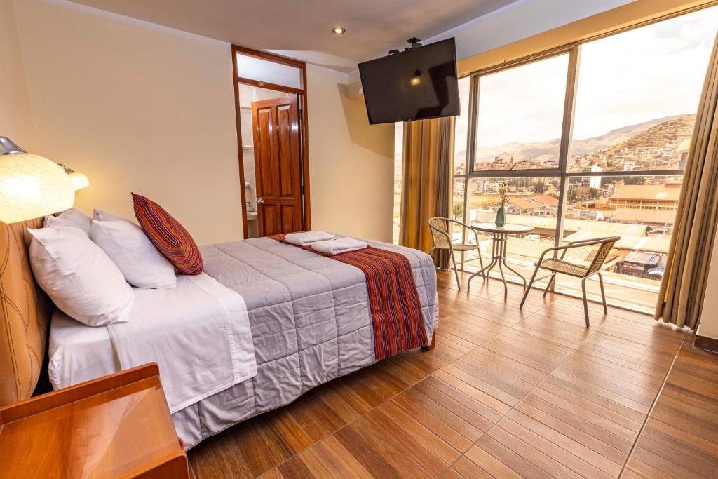 Postel nebo postele na pokoji v ubytování Hotel Sky Mirador