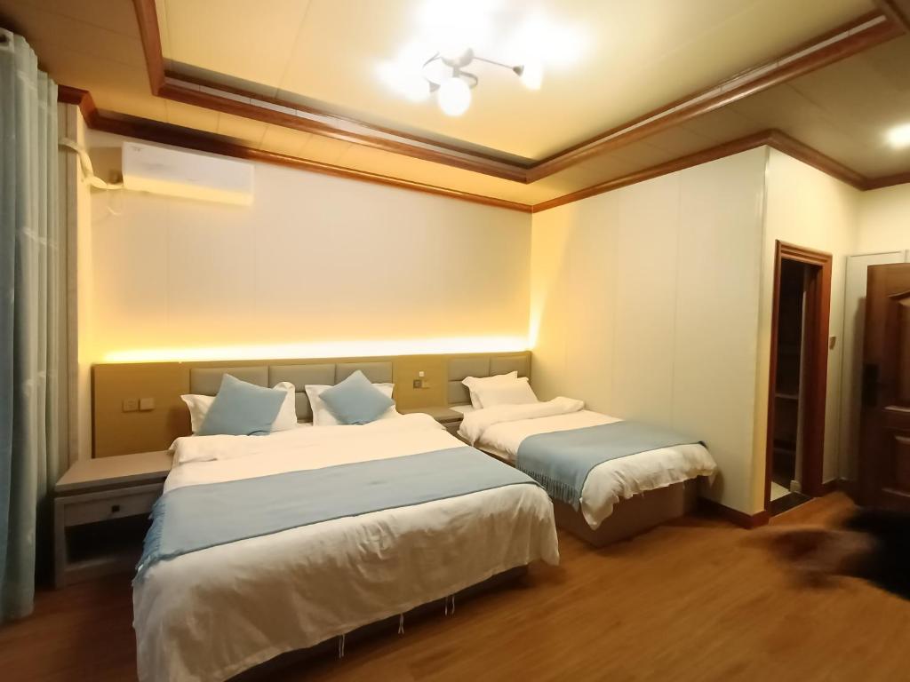 Postel nebo postele na pokoji v ubytování Meizhou Cloudy B&B