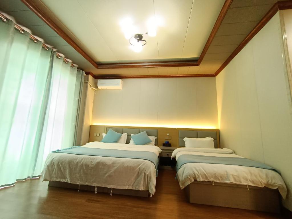Postel nebo postele na pokoji v ubytování Meizhou Cloudy B&B