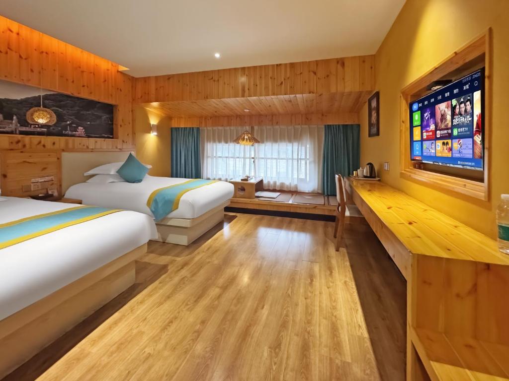 Postel nebo postele na pokoji v ubytování Yiwu Ruifeng Hotel