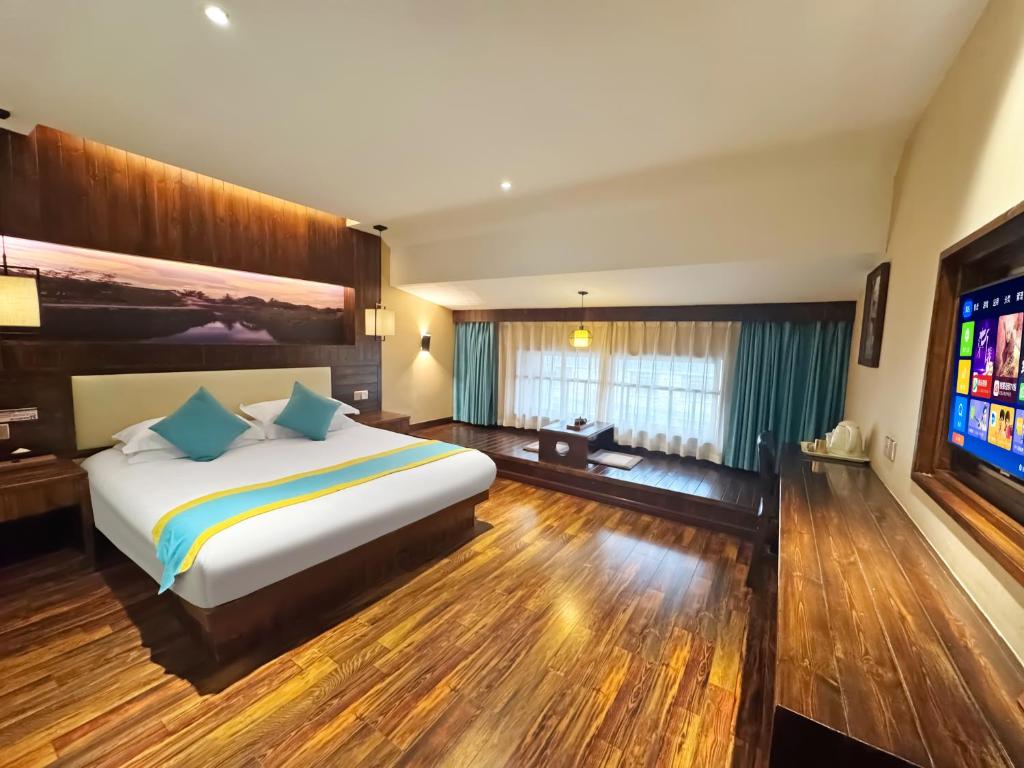 Postel nebo postele na pokoji v ubytování Yiwu Ruifeng Hotel