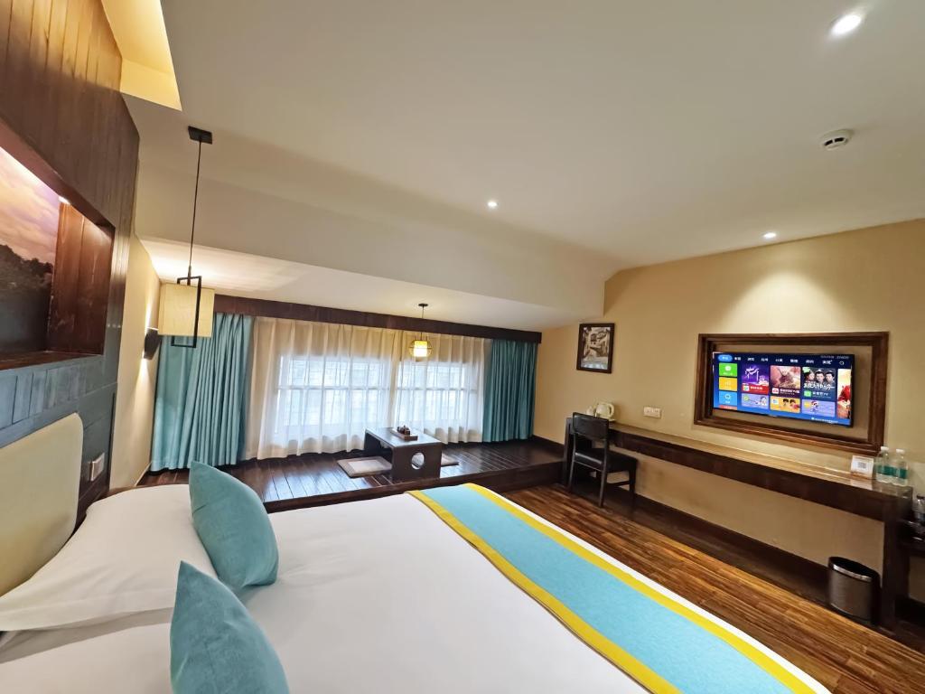 Postel nebo postele na pokoji v ubytování Yiwu Ruifeng Hotel