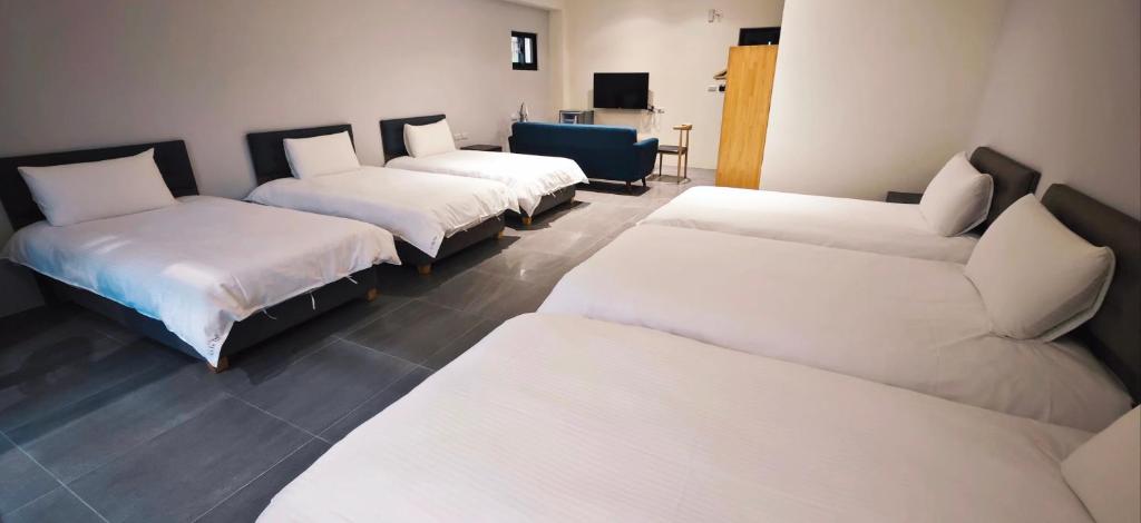 Postel nebo postele na pokoji v ubytování 風旅 Life inn-大風吹民宿登記澎湖縣民宿1265號