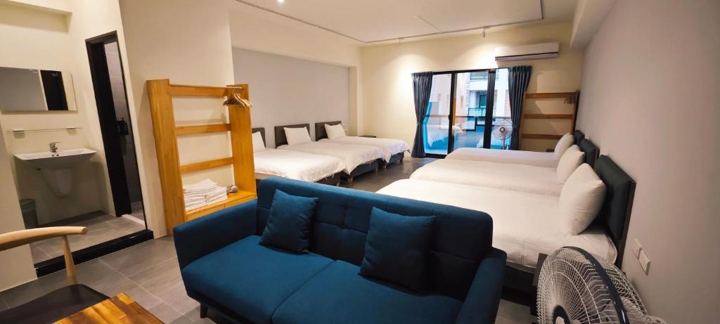 Postel nebo postele na pokoji v ubytování 風旅 Life inn-大風吹民宿登記澎湖縣民宿1265號