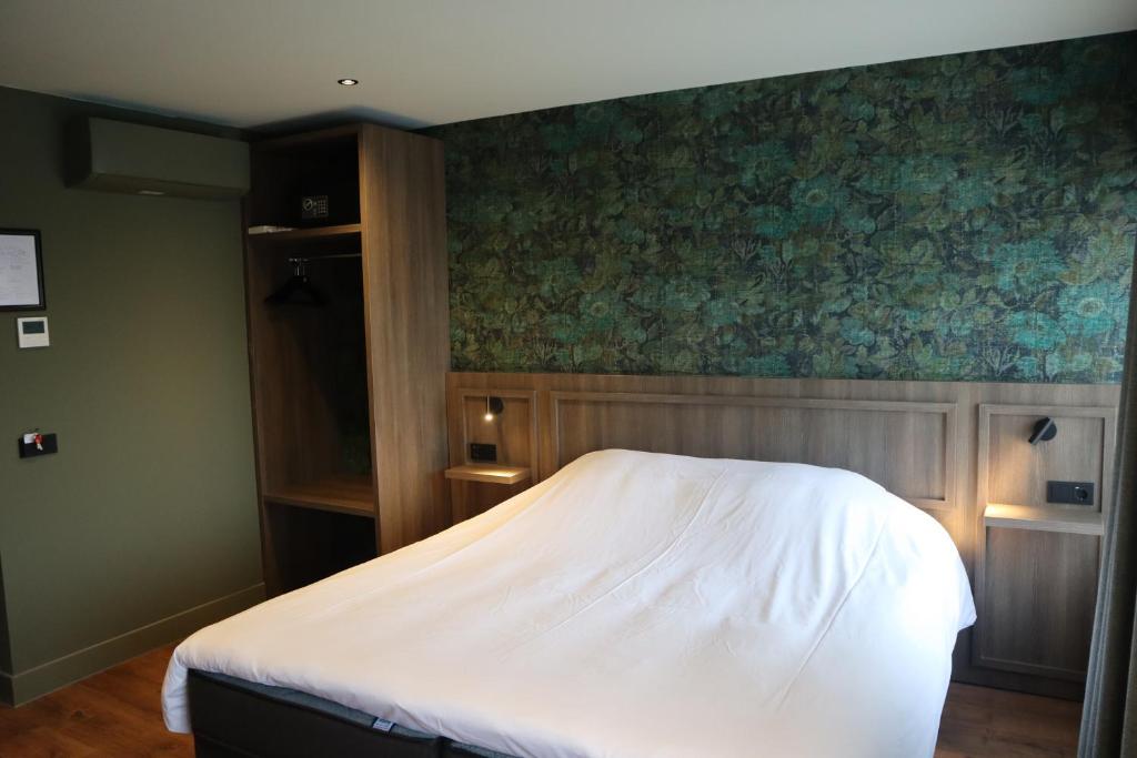 Postel nebo postele na pokoji v ubytování Hotel Central