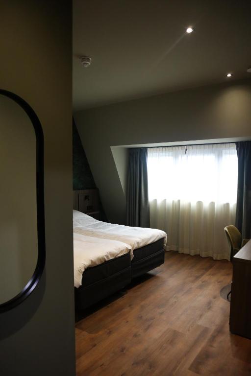 Postel nebo postele na pokoji v ubytování Hotel Central