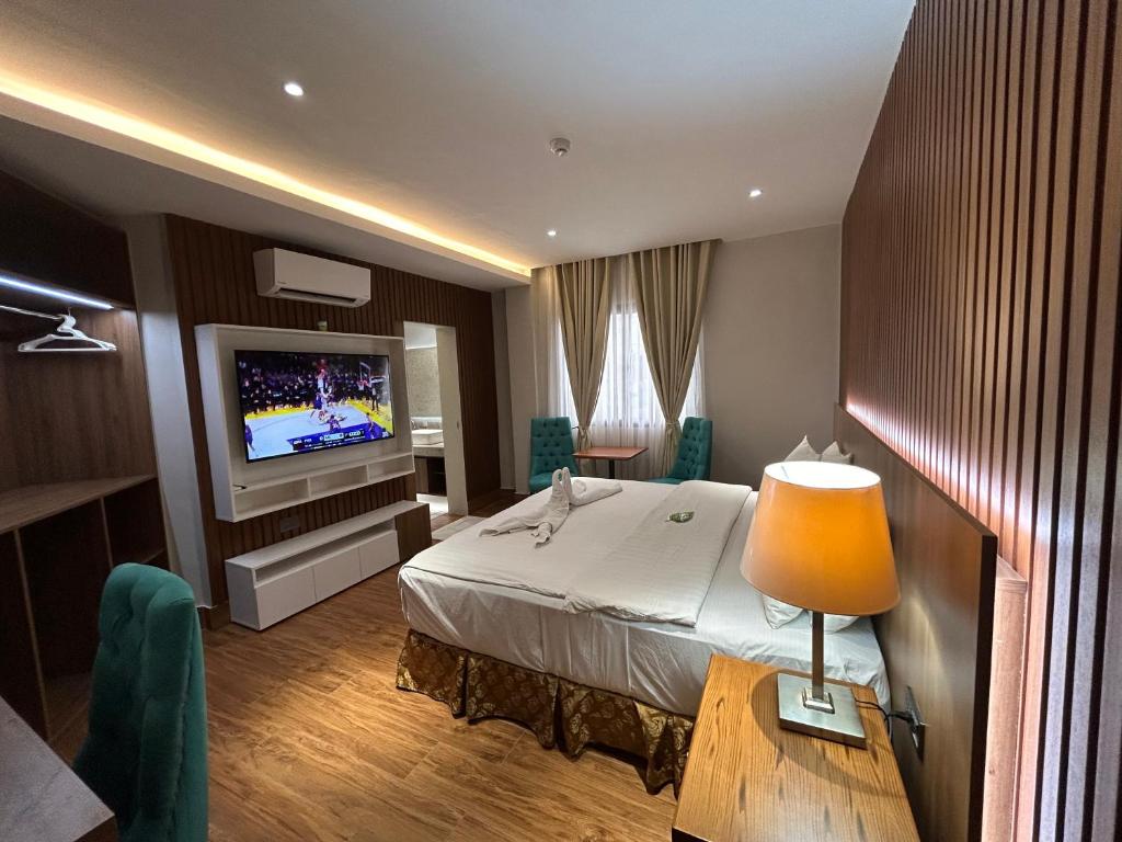 Postel nebo postele na pokoji v ubytování DM Residente Hotel Inns & Villas