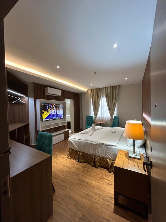 Postel nebo postele na pokoji v ubytování DM Residente Hotel Inns & Villas