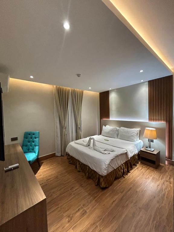Postel nebo postele na pokoji v ubytování DM Residente Hotel Inns & Villas