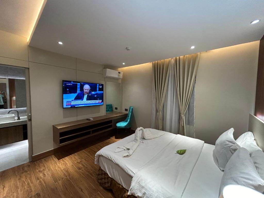 TV a/nebo společenská místnost v ubytování DM Residente Hotel Inns & Villas