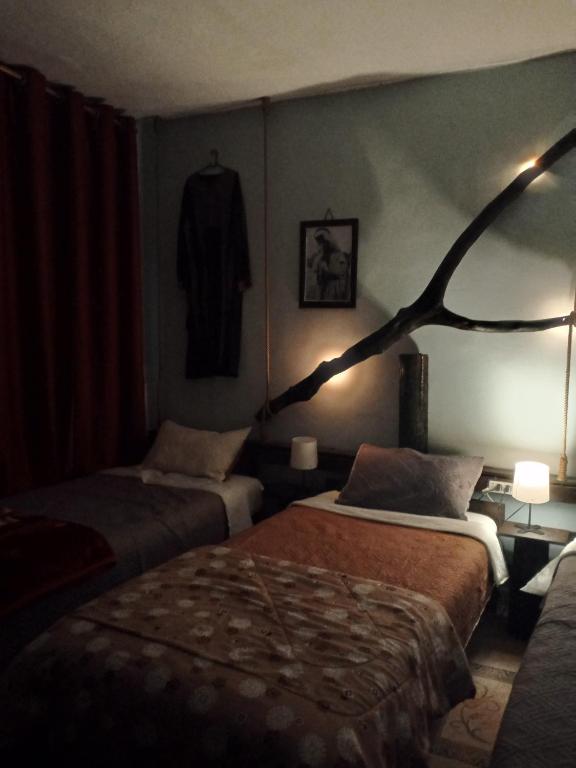 Postel nebo postele na pokoji v ubytování Petra Musa Rural House