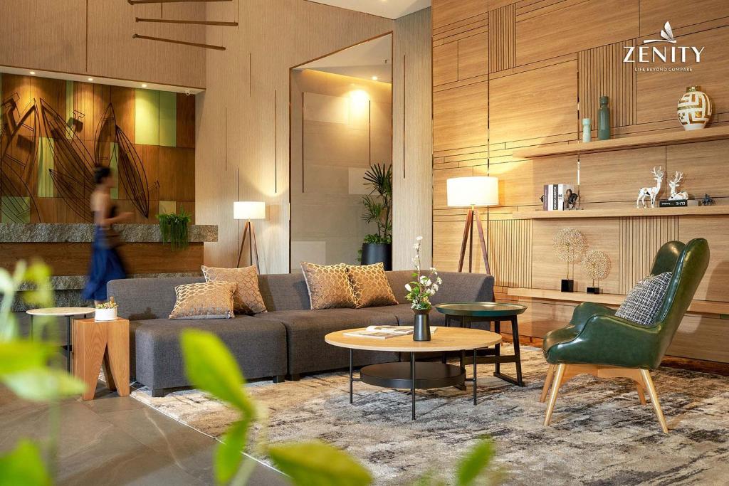 a living room with a couch and a table and chairs at RESidenza Condonium - D1mension & Zenity Tower, SG's Heart & Gym, Pool in Ho Chi Minh City