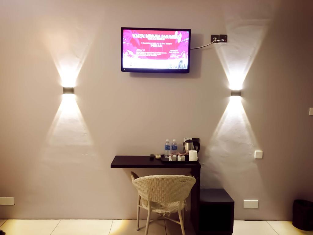 TV a/nebo společenská místnost v ubytování De Choice Hotel Tawau