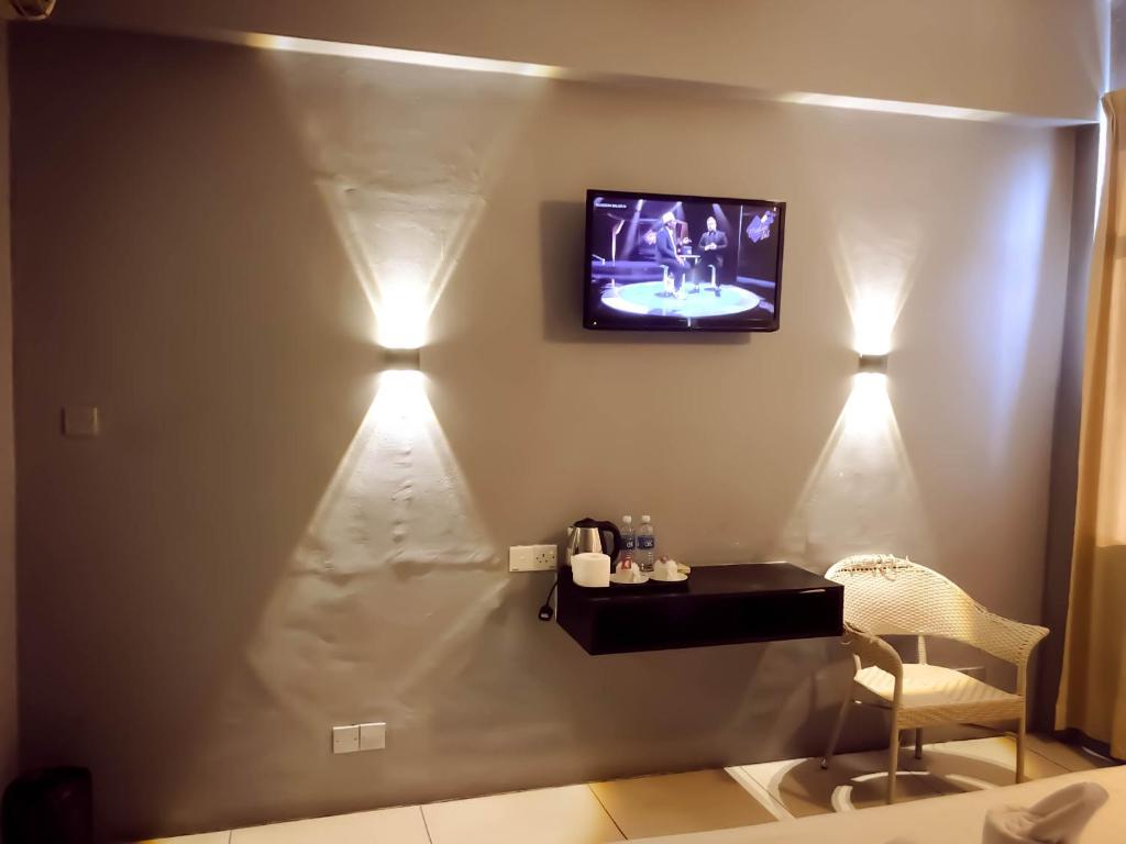 TV a/nebo společenská místnost v ubytování De Choice Hotel Tawau