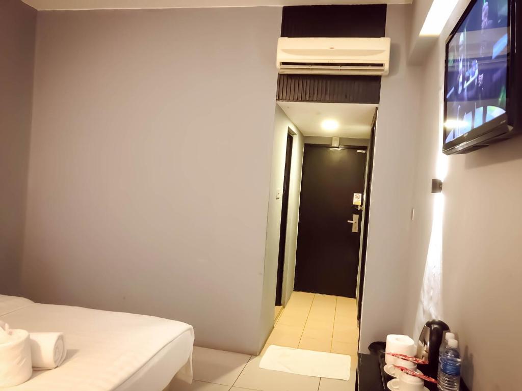 TV a/nebo společenská místnost v ubytování De Choice Hotel Tawau