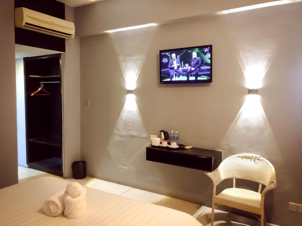 TV a/nebo společenská místnost v ubytování De Choice Hotel Tawau
