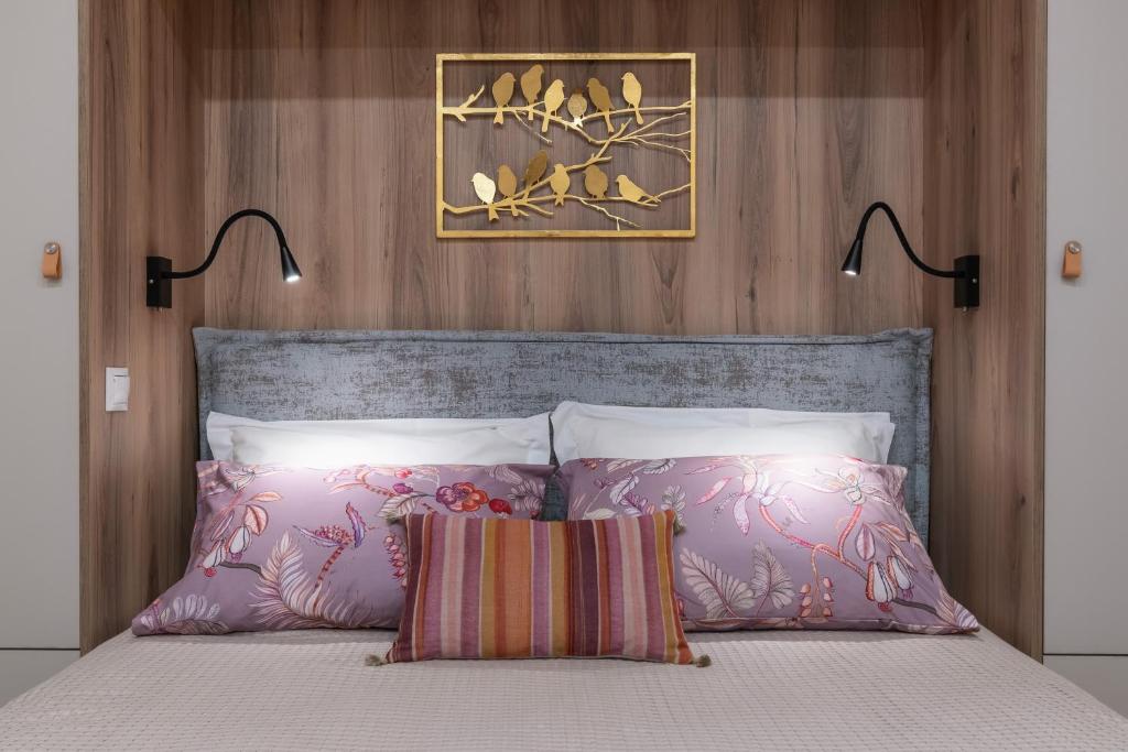 A bed or beds in a room at Absolute Athens Apartments