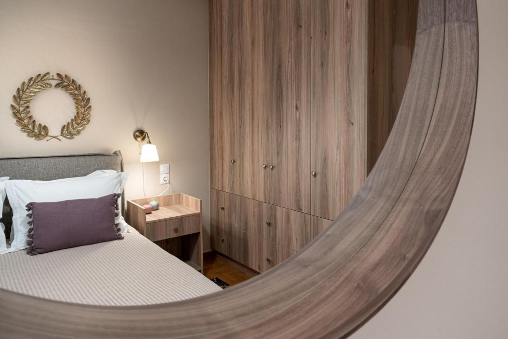 A bed or beds in a room at Absolute Athens Apartments