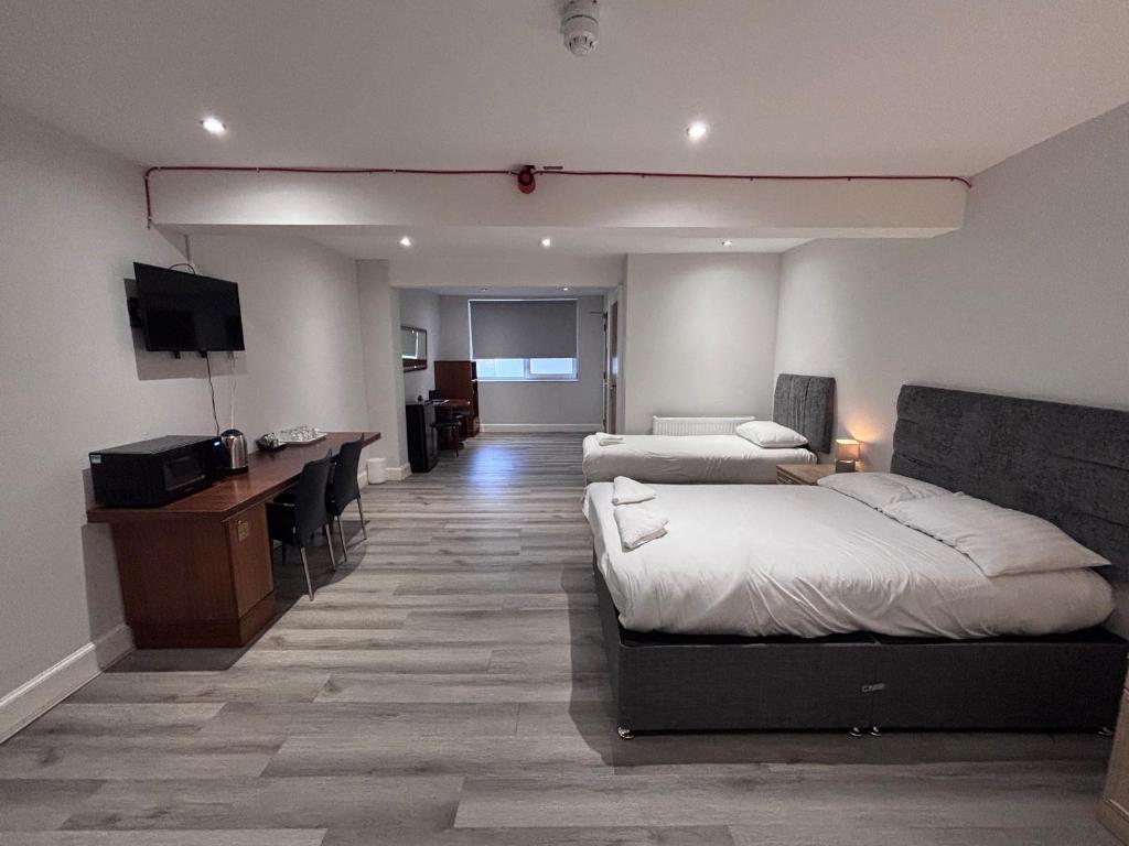Postel nebo postele na pokoji v ubytování Park View Rooms