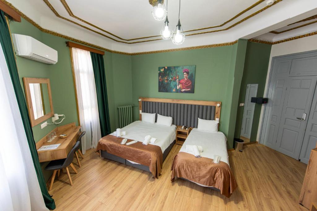 Postel nebo postele na pokoji v ubytování Nea Metropolis