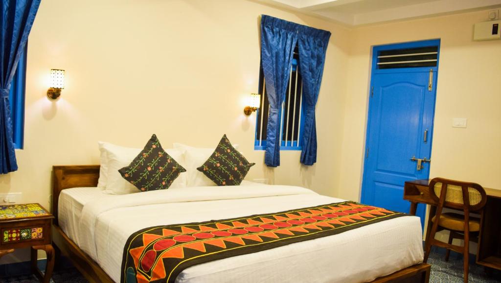 Postel nebo postele na pokoji v ubytování Ibex Resorts, Coimbatore Kakarla
