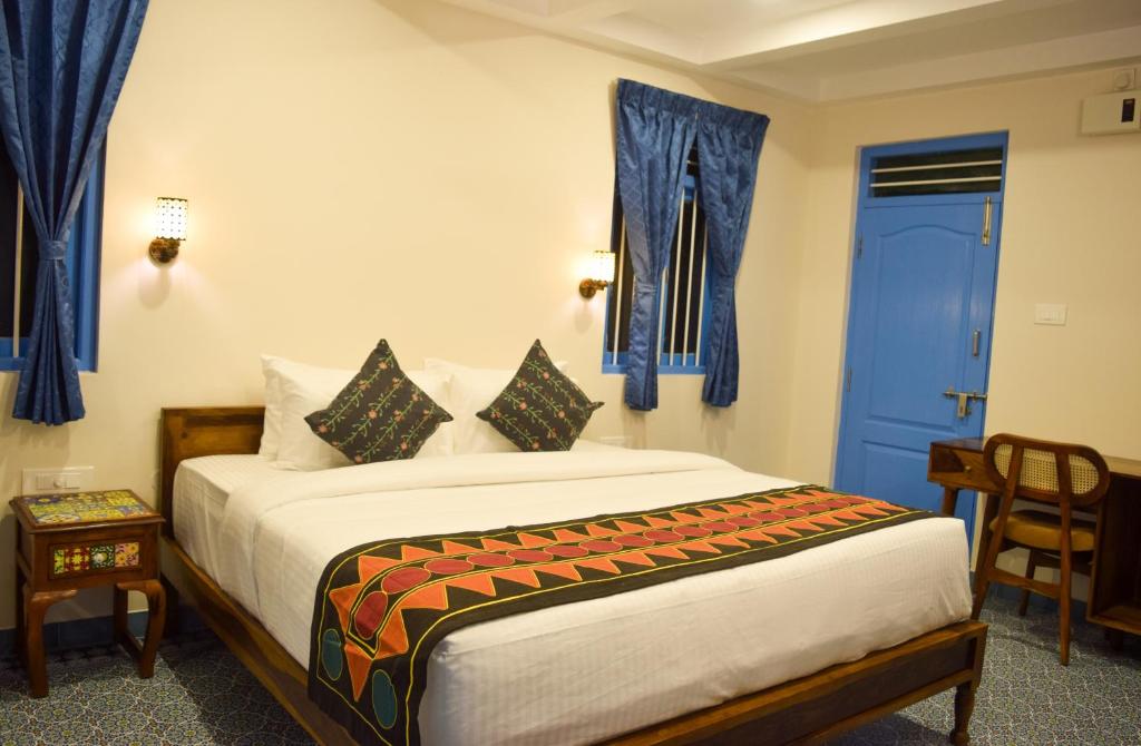 Postel nebo postele na pokoji v ubytování Ibex Resorts, Coimbatore Kakarla