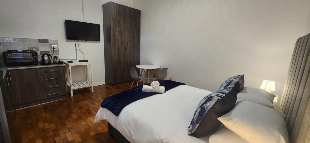 Postel nebo postele na pokoji v ubytování Carrington Guesthouse