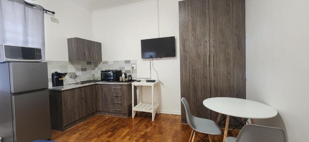 Kuchyň nebo kuchyňský kout v ubytování Carrington Guesthouse