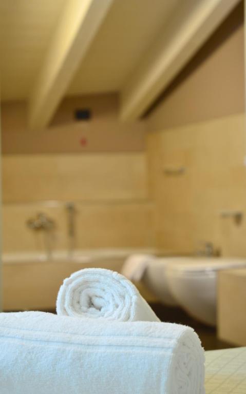 Postel nebo postele na pokoji v ubytování Locanda Blum In