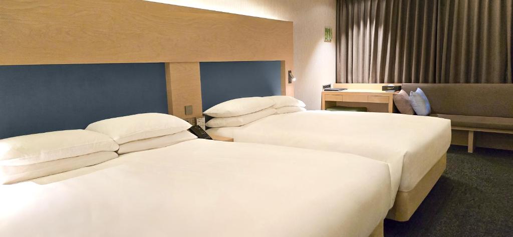 Krevet ili kreveti u jedinici u okviru objekta Hotel Midcity Myeongdong