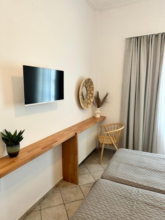 Postel nebo postele na pokoji v ubytování Anthousa Hotel