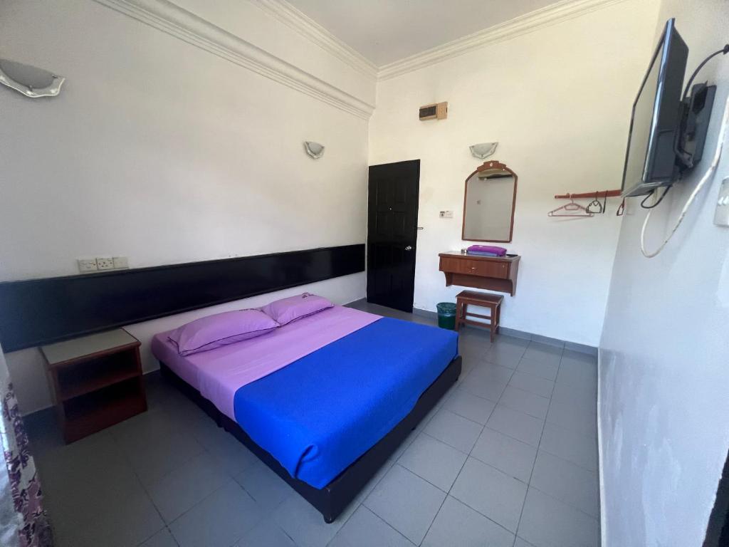 Postel nebo postele na pokoji v ubytování Dung Fang Hotel