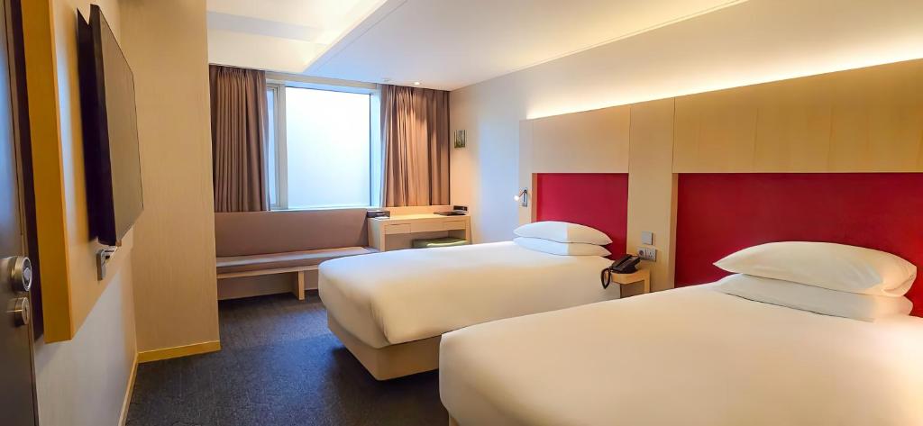 Krevet ili kreveti u jedinici u okviru objekta Hotel Midcity Myeongdong