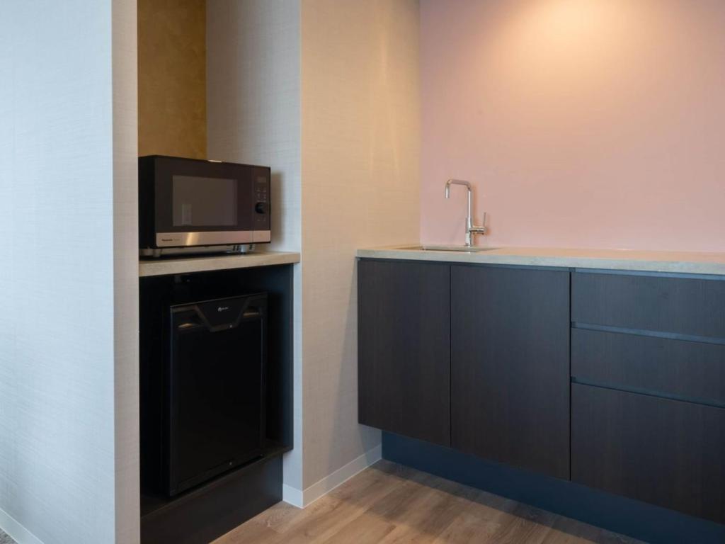 Kuchyň nebo kuchyňský kout v ubytování Loisir Hotel Kyoto Toji
