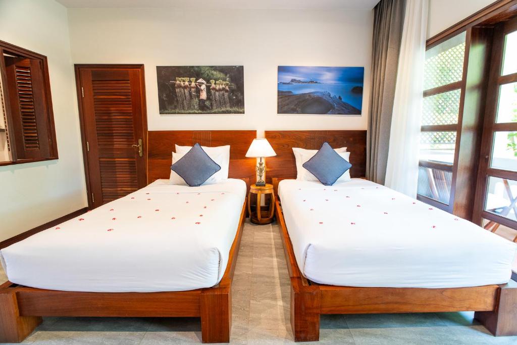 Phòng Deluxe Giường Đôi/2 Giường Đơn Với Ban Công Và Tầm Nhìn Ra Vườn