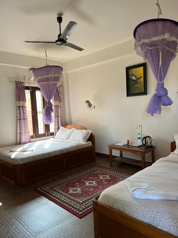 Postel nebo postele na pokoji v ubytování Tiger Residency Resort
