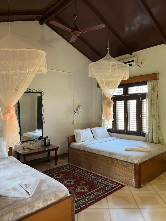Postel nebo postele na pokoji v ubytování Tiger Residency Resort
