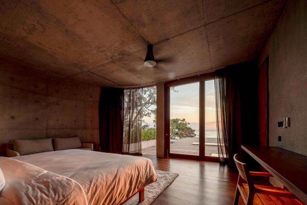 Postel nebo postele na pokoji v ubytování Vows Villa Beachfront