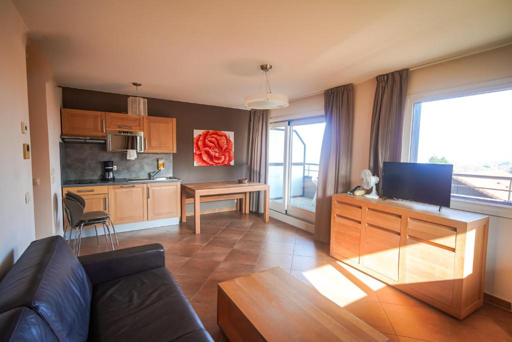 Kuchyň nebo kuchyňský kout v ubytování Residence Les Chataigniers