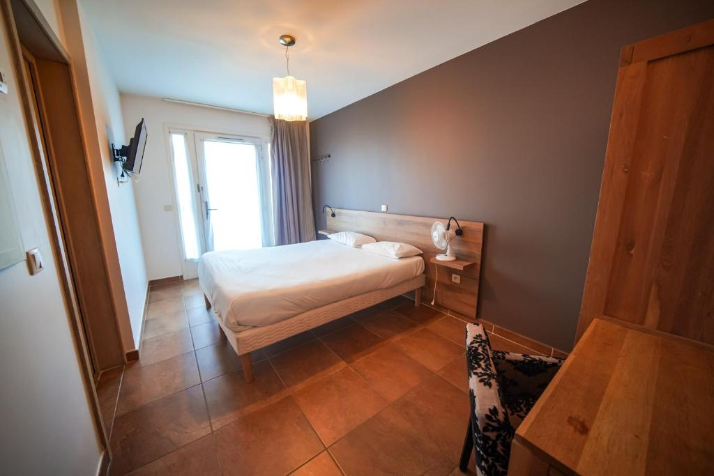 Postel nebo postele na pokoji v ubytování Residence Les Chataigniers