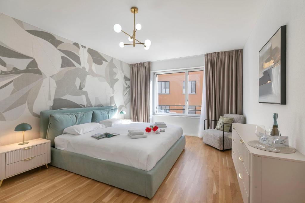 a bedroom with a bed with a flowery wall at Novos Contrada in Lugano