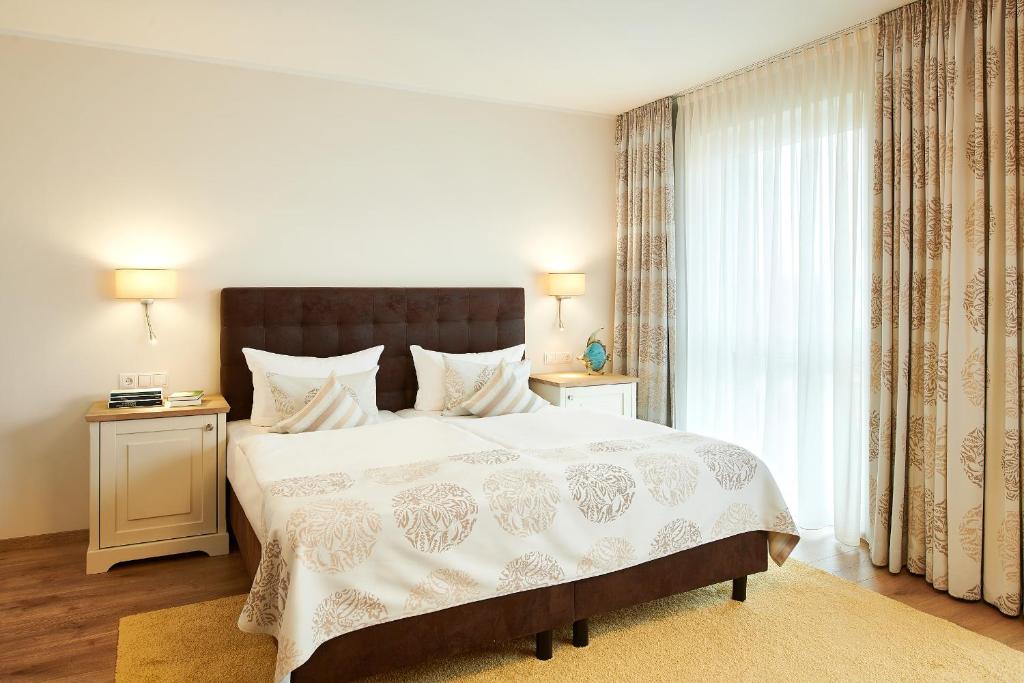 Postel nebo postele na pokoji v ubytování Hotel Nautilus