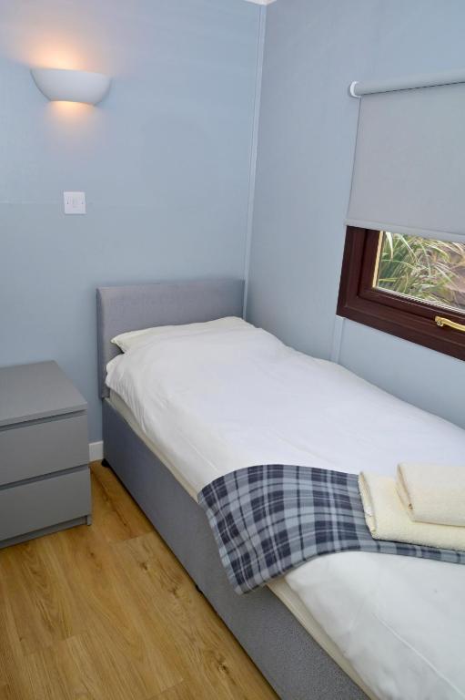 Postel nebo postele na pokoji v ubytování Lagavulin 3