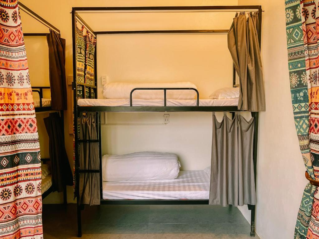 Postel nebo postele na pokoji v ubytování Pai Home