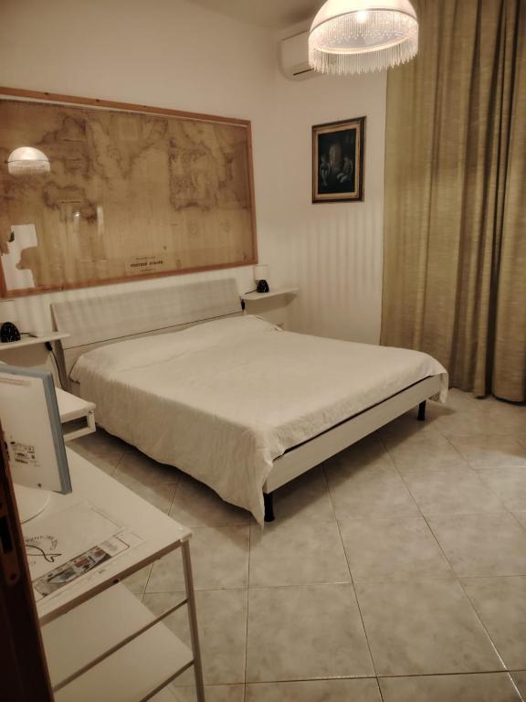 a bedroom with a large bed and a table at Cavo Beach 5 in Cavo