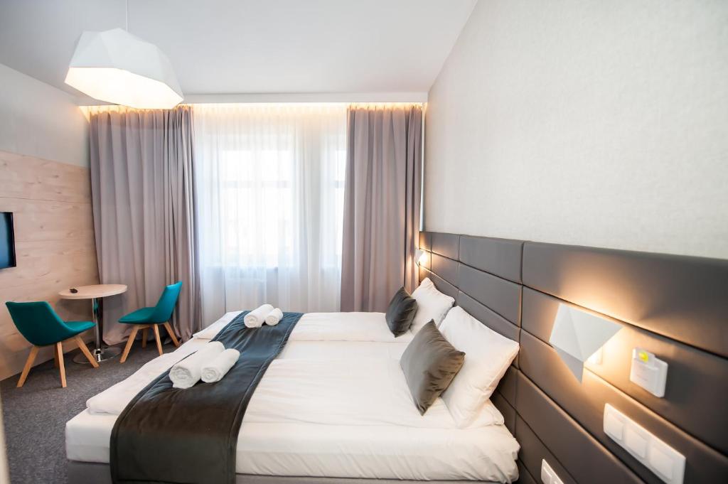 Postel nebo postele na pokoji v ubytování Hotel Gdynia Boutique