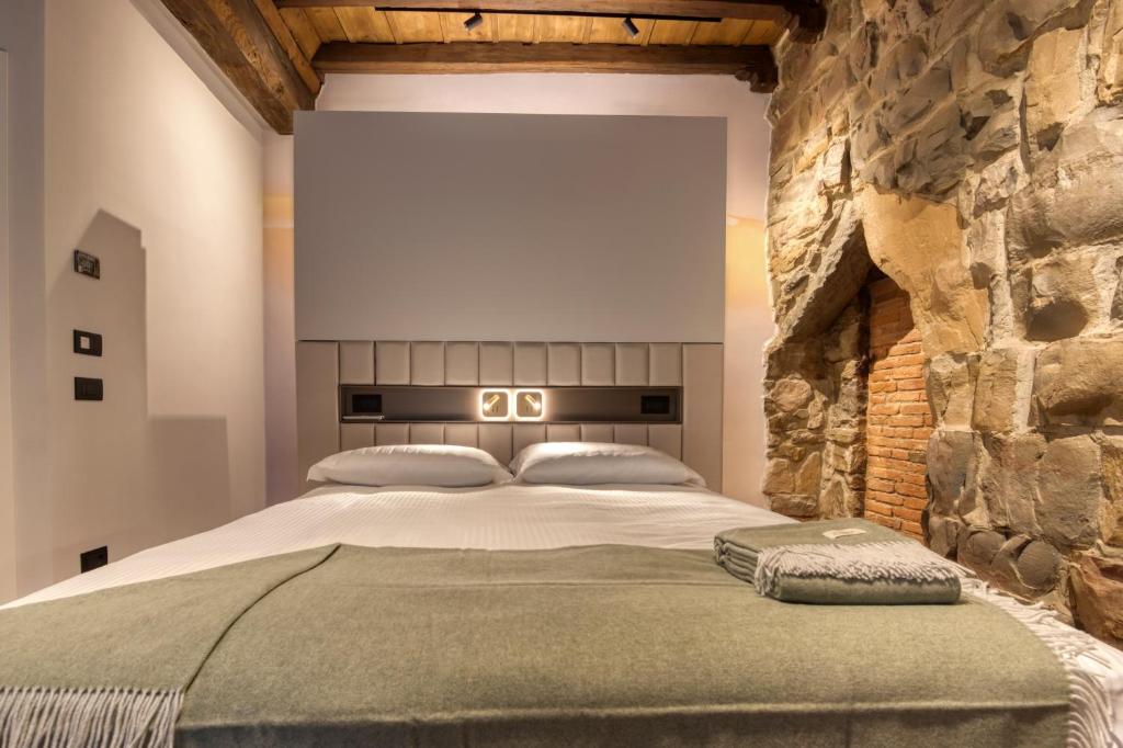 Postel nebo postele na pokoji v ubytování Le Torri Suites